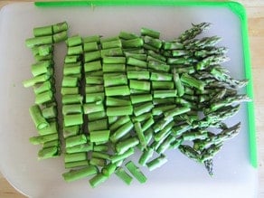 Asparagus sliced into sections.