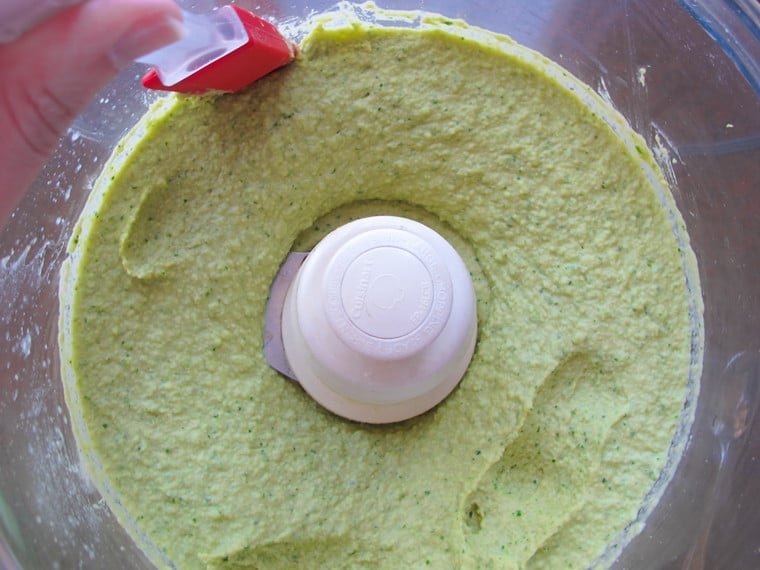 Pureed hummus in food processor.