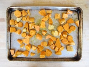 Diced potatoes on a baking sheet.