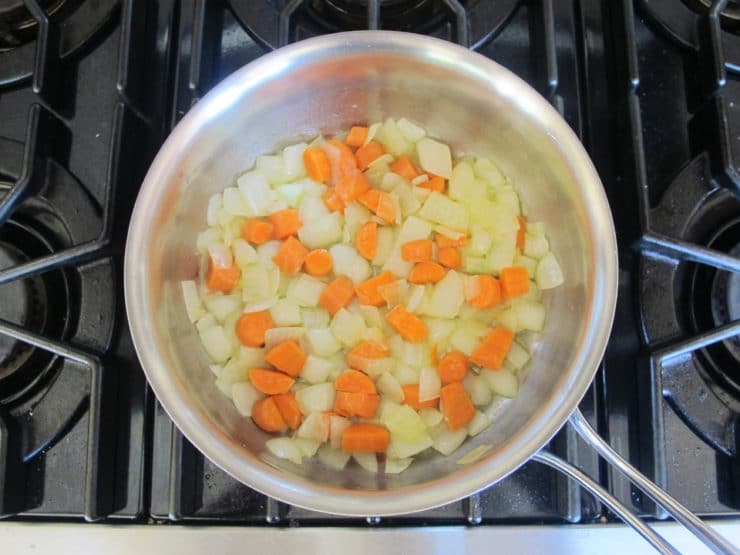 Carrots and onions sauteeing.