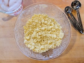 Butter incorporated in dry ingredients for pie crust.