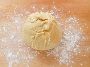 Dough ball on floured counter.