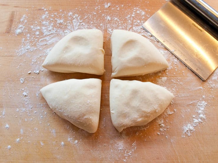 Dough cut into four pieces.