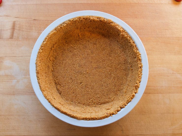 Strawberry Chiffon Pie - Light and Fluffy Strawberry Filling Inside of a Crisp Graham Cracker Crust and Topped with Whipped Cream. Time-Tested Family Recipe.
