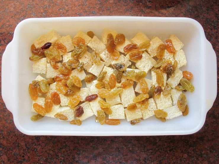 Cubed bread in a baking dish.