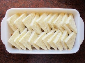 Triangles of bread across a baking dish.
