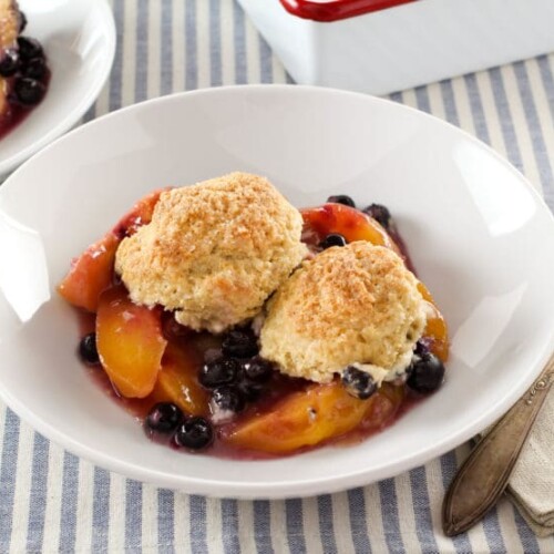Delicious drop biscuit cobblers with bubbling fruit filling peeking out from under a layer of golden brown biscuits