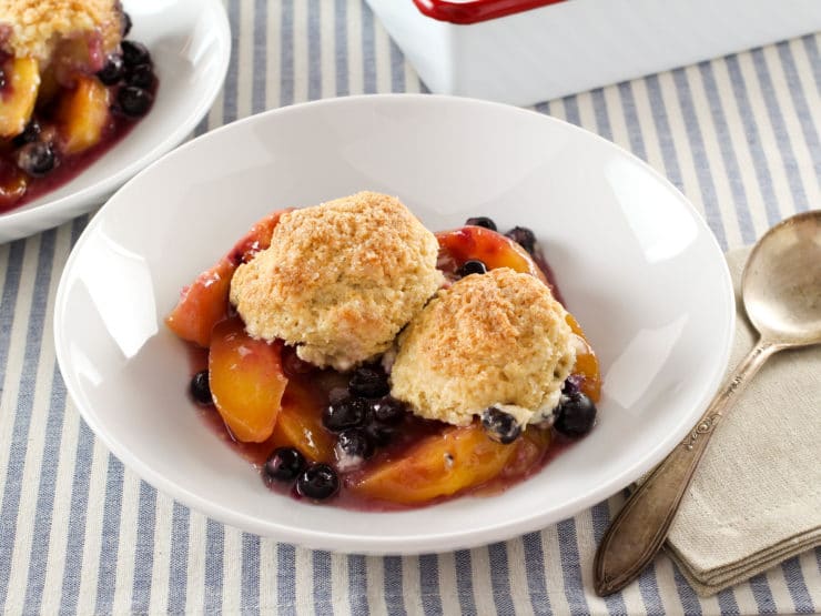 Delicious drop biscuit cobblers with bubbling fruit filling peeking out from under a layer of golden brown biscuits