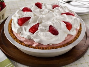 Strawberry Chiffon Pie - Light and Fluffy Strawberry Filling Inside of a Crisp Graham Cracker Crust and Topped with Whipped Cream. Time-Tested Family Recipe.