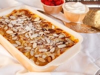 Bread Pudding topped with slivered almonds.
