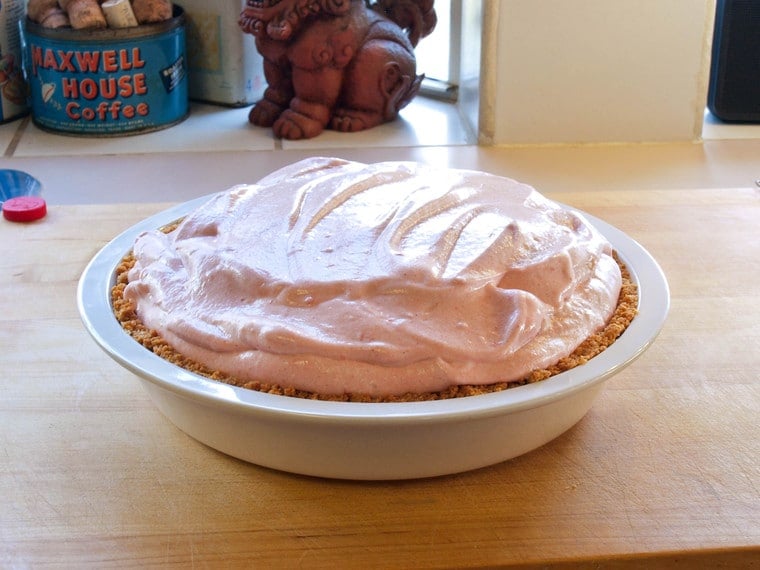 Strawberry Chiffon Pie - Light and Fluffy Strawberry Filling Inside of a Crisp Graham Cracker Crust and Topped with Whipped Cream. Time-Tested Family Recipe.