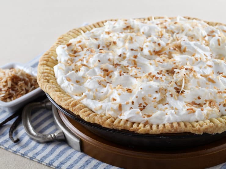 Coconut Cream Pie – Flaky All-Butter Crust Filled with Coconut Cream and Topped with Lightly Sweetened Whipped Cream and Toasted Coconut. Nostalgic, Family-Inspired Recipe from Kelly Jaggers.