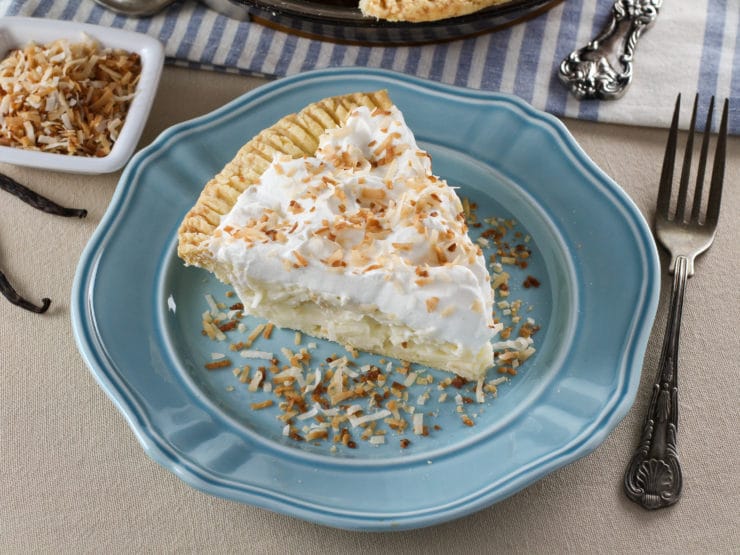 Coconut Cream Pie – Flaky All-Butter Crust Filled with Coconut Cream and Topped with Lightly Sweetened Whipped Cream and Toasted Coconut. Nostalgic, Family-Inspired Recipe from Kelly Jaggers.