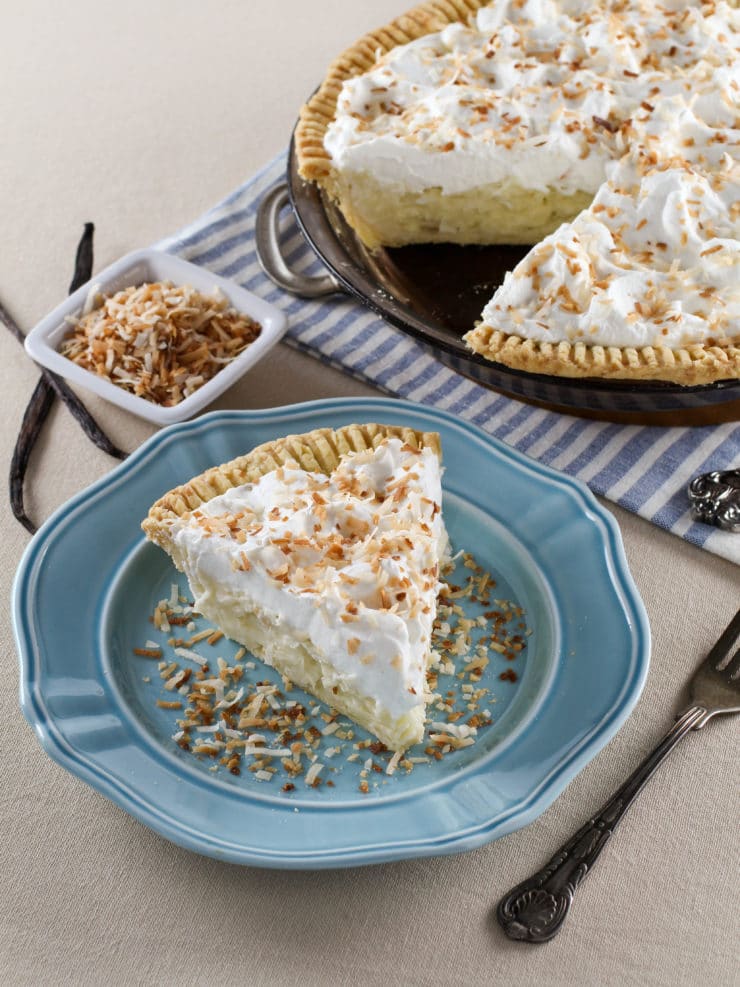 Coconut Cream Pie – Flaky All-Butter Crust Filled with Coconut Cream and Topped with Lightly Sweetened Whipped Cream and Toasted Coconut. Nostalgic, Family-Inspired Recipe from Kelly Jaggers