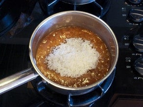 Brown sugar icing with coconut in pot