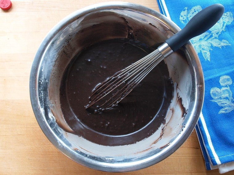 Texas Sheet Cake - Rich, Moist Chocolate Sheet Cake Topped with Chocolate Frosting and Toasted Pecans. Tried-and-True, Quintessential Texas Dessert Recipe.