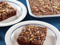 Serving of two plates with delicious brownies or Texas Sheet Cake