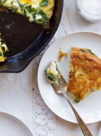 A delicious spinach and feta frittata served on a plate, ready to be enjoyed