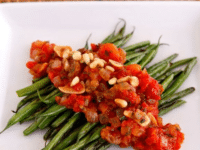 Fresh green beans cooked in a flavorful caponata sauce with tomatoes, onions, and herbs