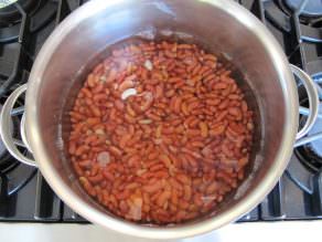 Kidney beans boiling in a pot on the stove