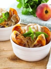 Grilled Peach Sundae with Brandy Butterscotch Sauce - Recipe for grilled ripe peaches and creamy caramelized sauce over vanilla frozen yogurt. 
