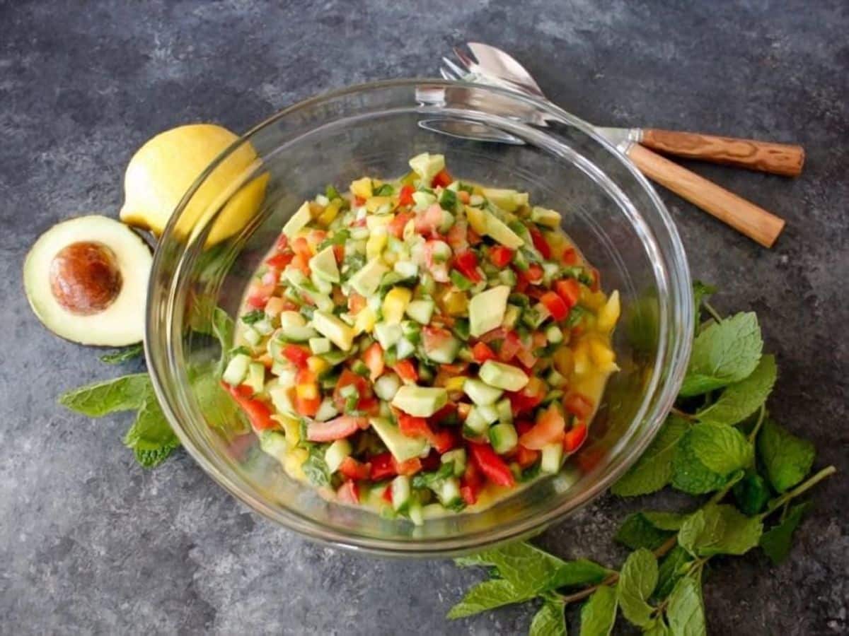 Israeli Salad with Avocado and Mint - Crunchy fresh and healthy salad with cucumber, tomatoes, bell peppers, lemon and mint. 