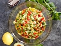 Israeli Salad with Avocado and Mint - Crunchy fresh and healthy salad with cucumber, tomatoes, bell peppers, lemon and mint.