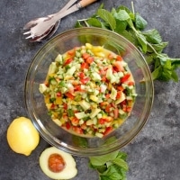 Israeli Salad with Avocado and Mint - Crunchy fresh and healthy salad with cucumber, tomatoes, bell peppers, lemon and mint. 