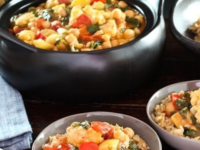 Bowls of vegan curried vegetable food with colorful vegetables