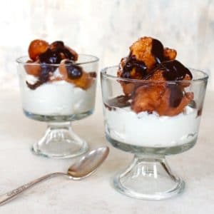 Two Hanukkah Fritter Sundaes in Glass Bowls with Spoon.