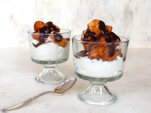 Two Hanukkah Fritter Sundaes in Glass Bowls with Spoon.