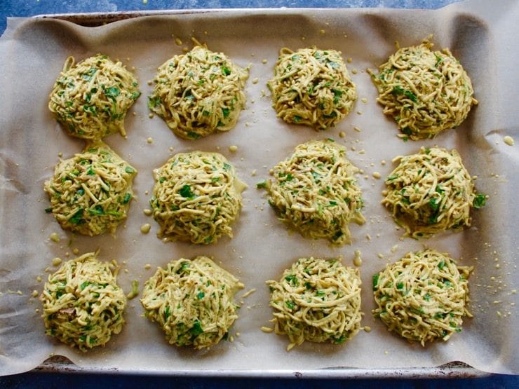 Top view of potato pancake patties set line on baking sheet