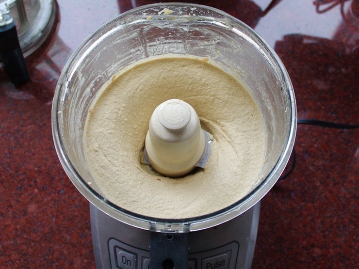 Hummus blended to a creamy, light, silky texture in food processor.