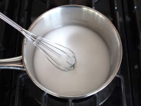 Potato starch and water in small stainless steel saucepan on stovetop.