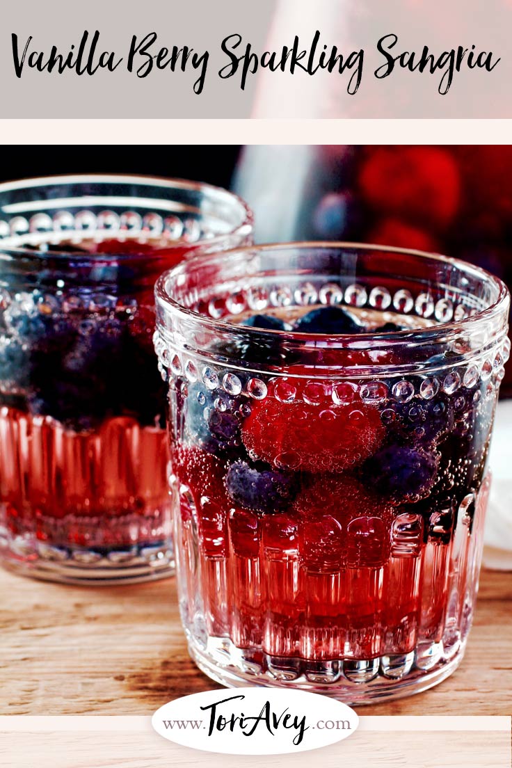 Vanilla Berry Sparkling Sangria Recipe with Rosé - A sweet sparkling sangria recipe with fresh berries, rosé, rum, sparkling water and vanilla bean. | ToriAvey.com #mothersday #sangria #sweet #vanilla #berry #seltzer #drink #cocktail #brunch #rose #springtime #springcocktail #howto