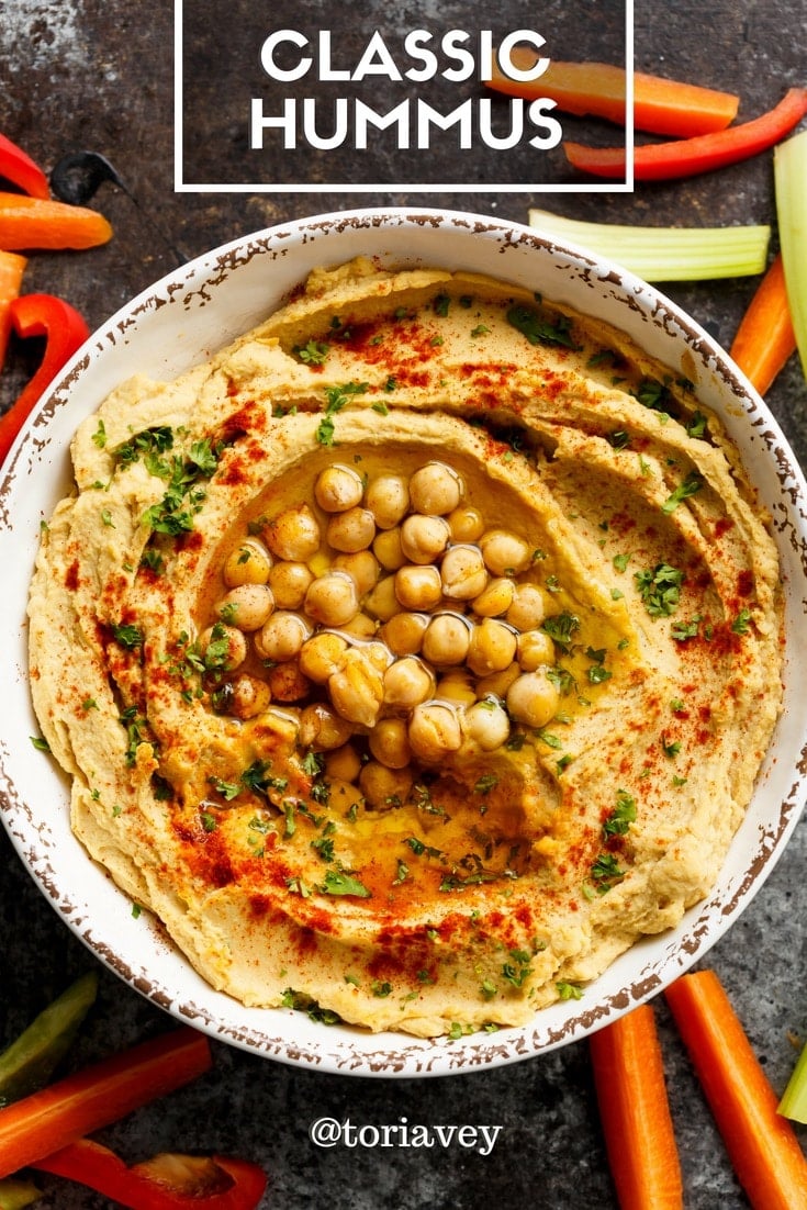Classic Hummus - make smooth, creamy, authentic Middle Eastern hummus. Includes easy chickpea peeling technique. | ToriAvey.com #hummus #dip #tahini #garlic #lemon #oliveoil #evoo #easyrecipe #vegetarian #vegan #cleaneating #kosher #veganprotein #chickpeas #garbanzobeans #appetizer #snack #healthy #lightenup #glutenfree