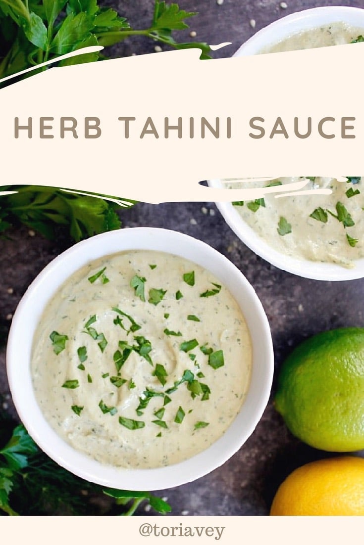 Herb Tahini Sauce - a classic creamy tahini paired with fresh parsley and dill, roasted garlic, lemon and lime juice for a unique and healthy vegan condiment. This sauce can be added to fish, grilled or roasted vegetables, meat dishes and more. | ToriAvey.com #vegan #tahini #herbs #healthy #mediterranean #lemon #lime #TorisKitchen