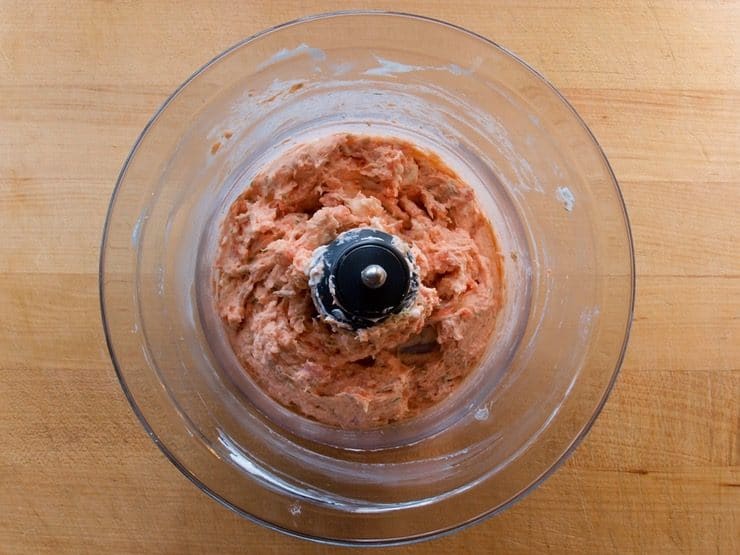 Ground lox in a food processor bowl.