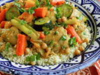 A delicious plate of chicken vegetable couscous, a healthy and flavorful meal option served on a table