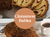 A close-up of a freshly baked cinnamon babka, with a golden-brown crust and swirls of cinnamon filling