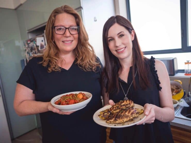 Adeena Sussman and Tori Avey cooking together in Adeena's kitchen, Tel Aviv, Israel.