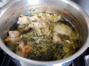 Fully cooked ingredients in chicken stock pot after long simmer.
