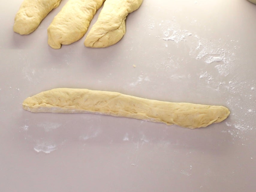 Over head shot of challah dough in a long strand.