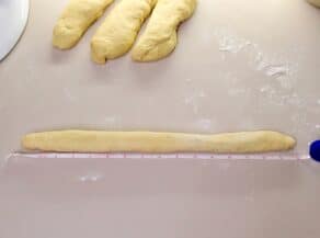 Over head shot of challah dough in a long strand.