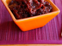 Spiced Fig Preserves Pinterest Pin - Fig Preserves on a small orange square-shaped bowl.