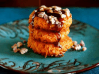 Sweet Potato Latkes Pinterest Pin - Stack of sweet potato cookies served with Brown Sugar Syrup and Cayenne Candied Pecans